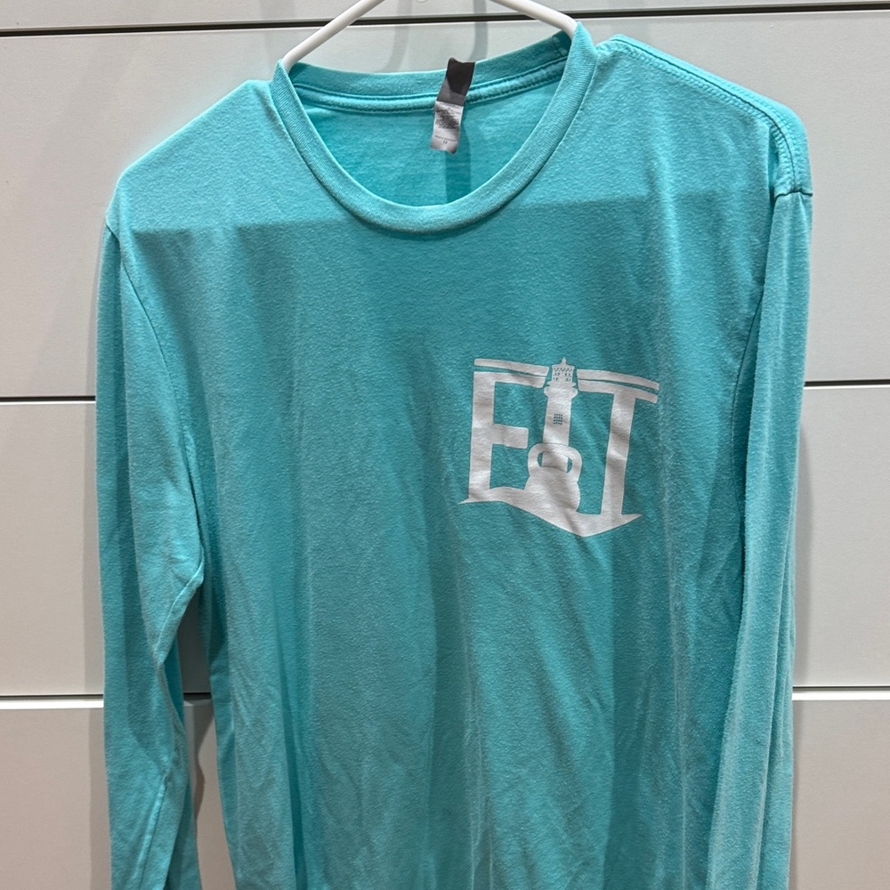 Unisex Teal Long Sleeve Shirt Size M
Fit Town Jupiter Florida
